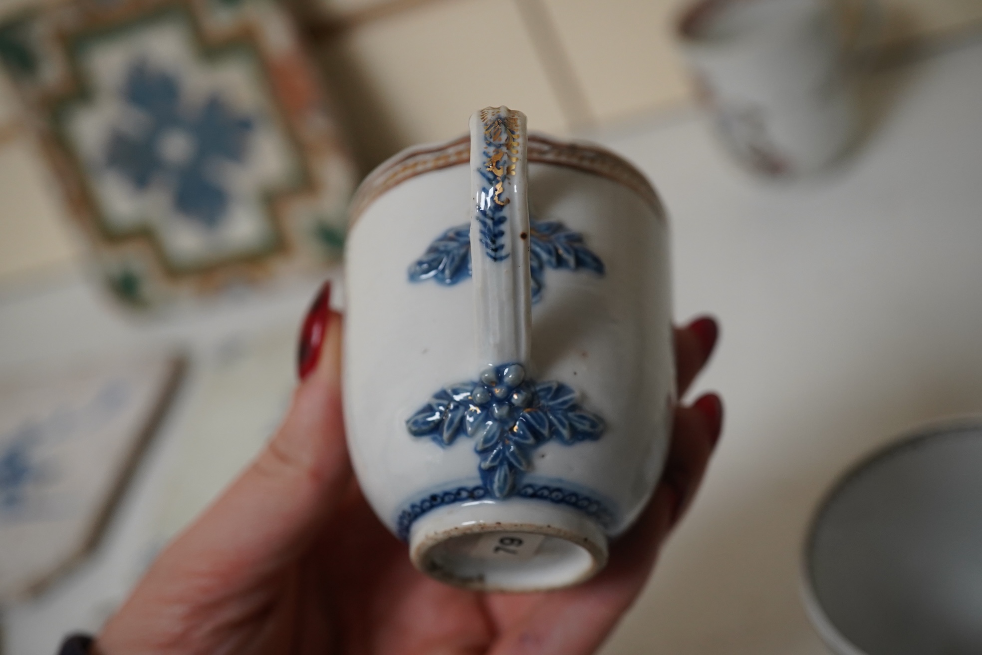 Six assorted 18th century Chinese export coffee cups with armorial decoration, and a similar European subject cup and saucer. Condition - damaged/restored